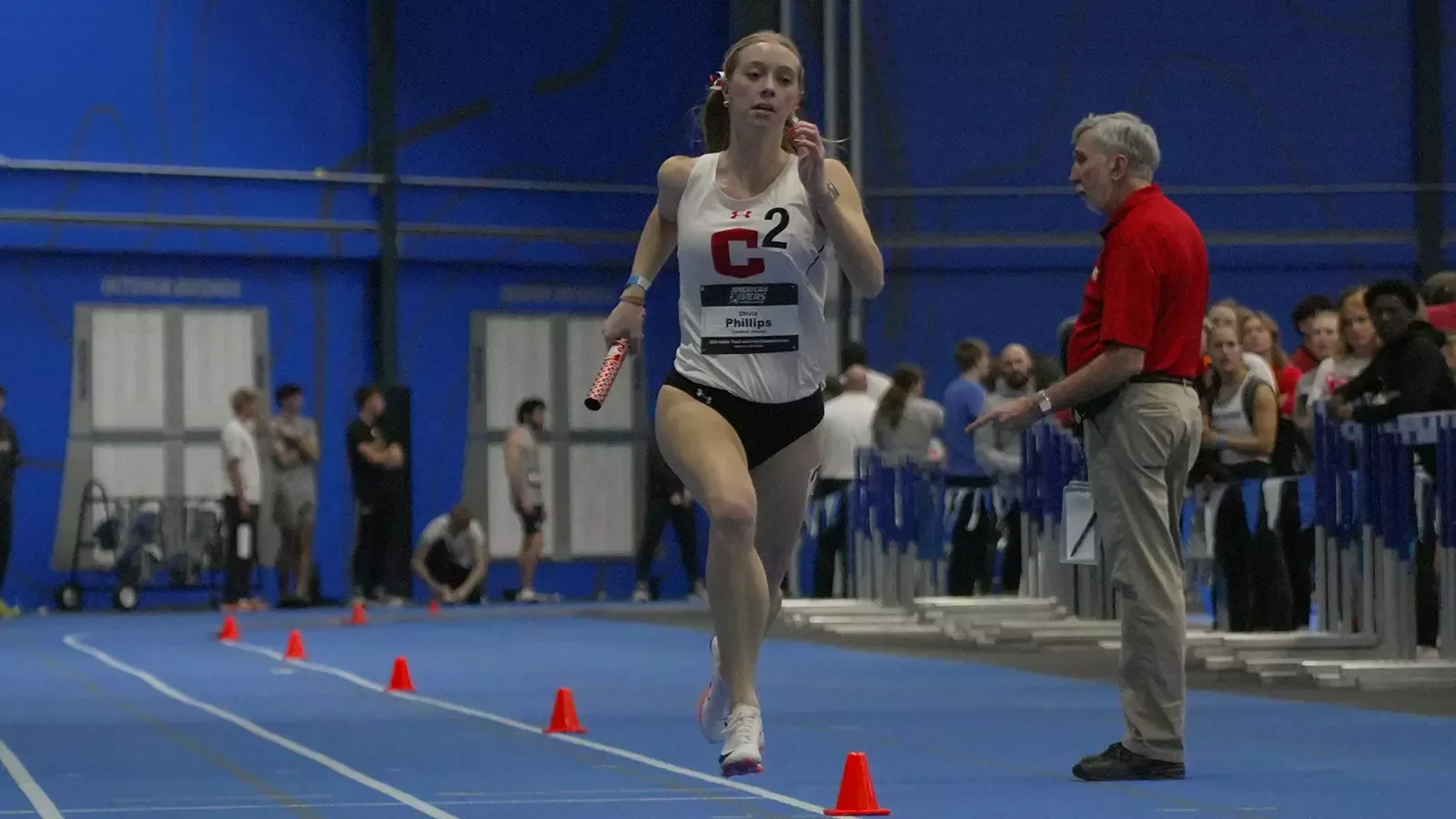 Olivia Phillips running in relay at the A-R-C Championships