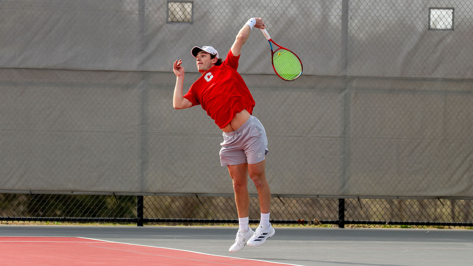 Ernest Alvarez Chedzoy serves against Willamette