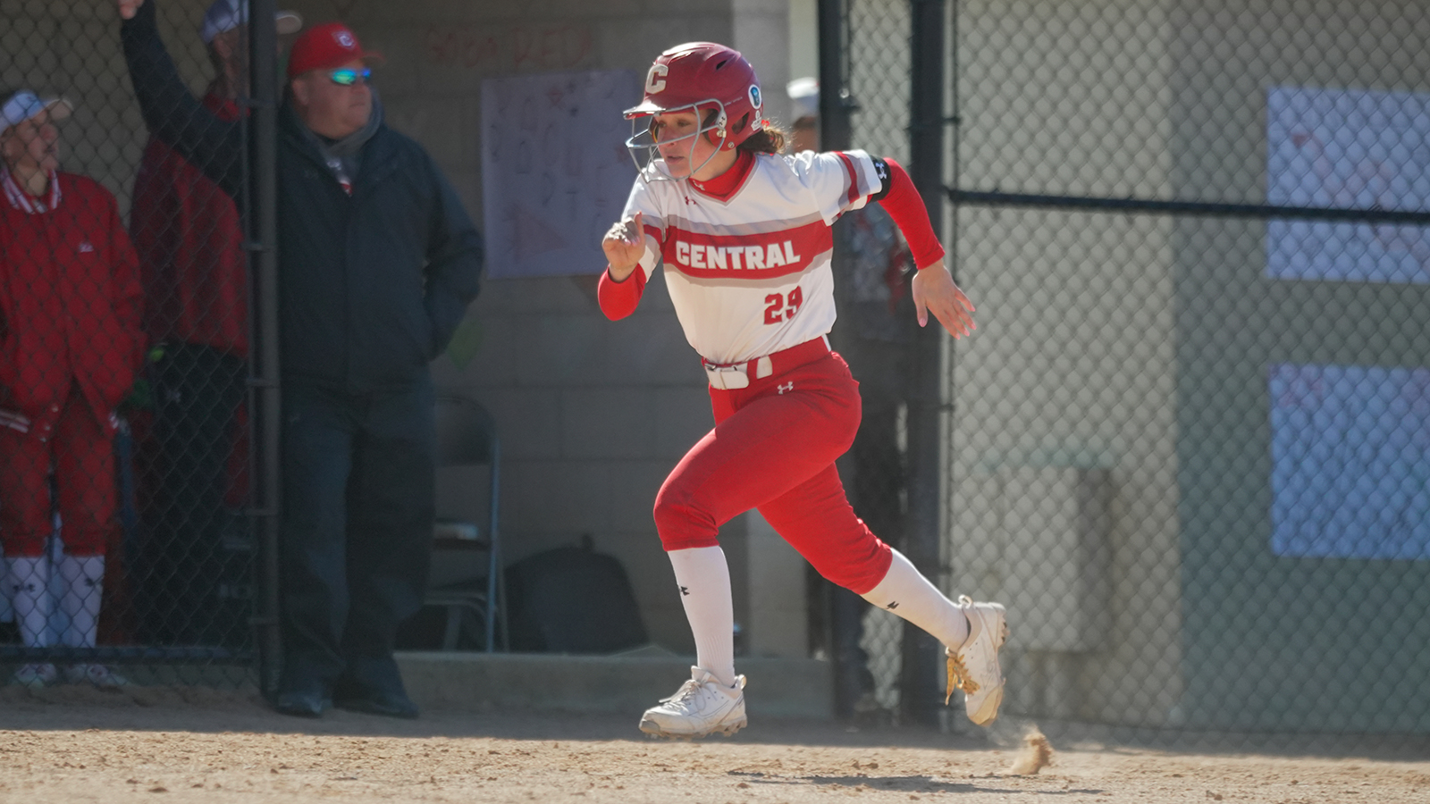Larissa Miller running home from third base