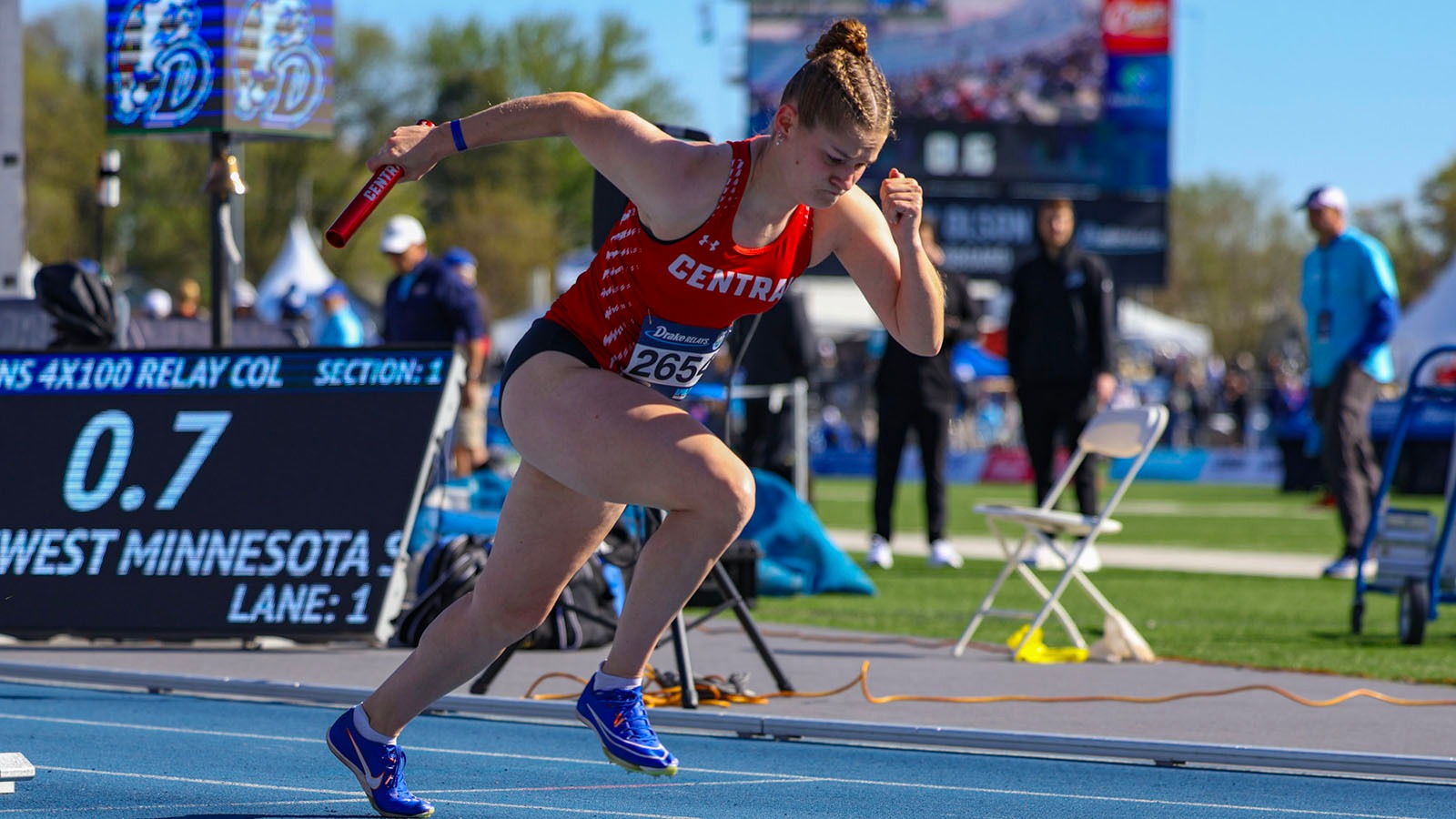 Mary Gustason starts a relay race at Drake Relays
