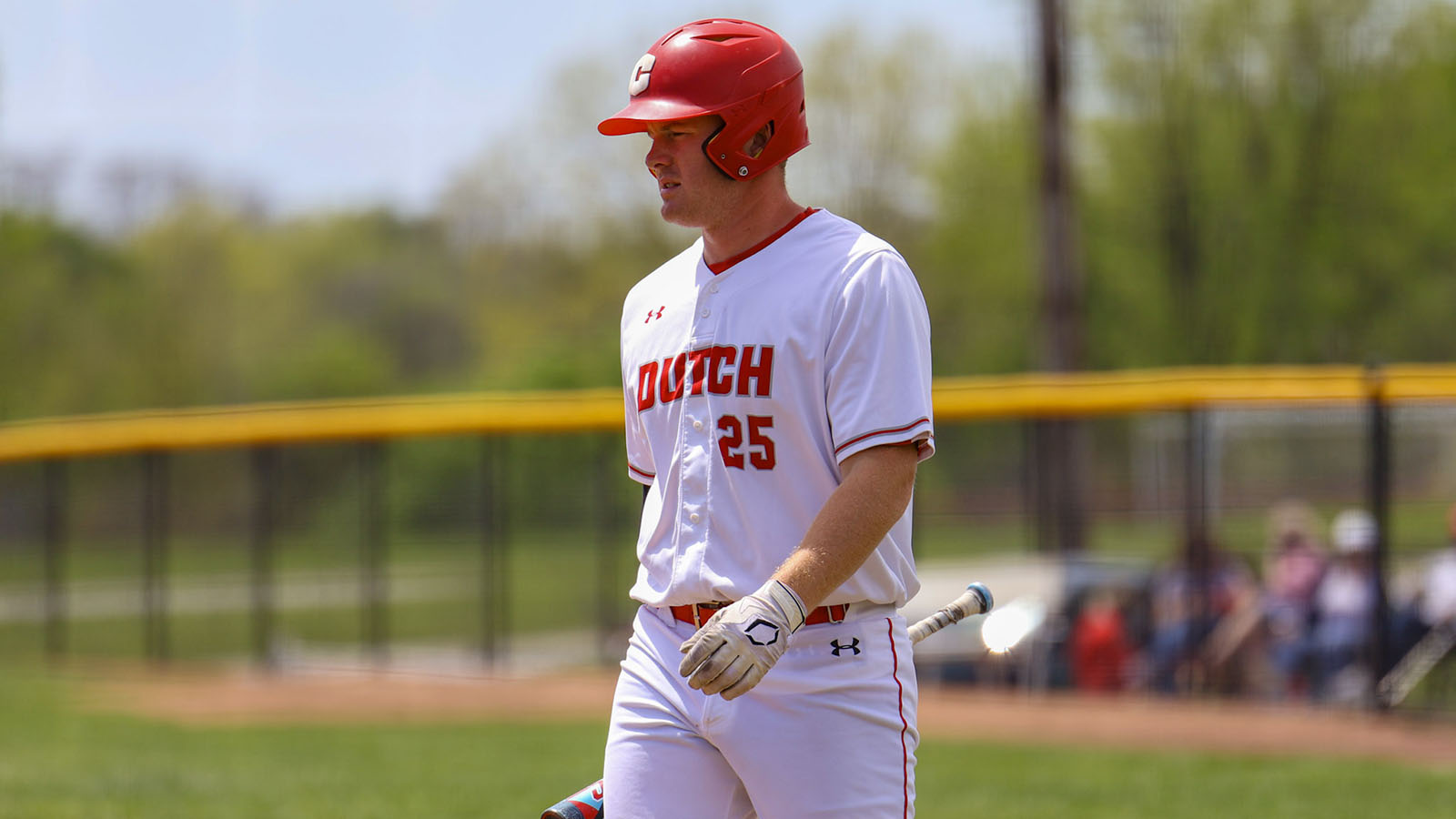 Brayden Sawyer walks to the plate against Dubuque