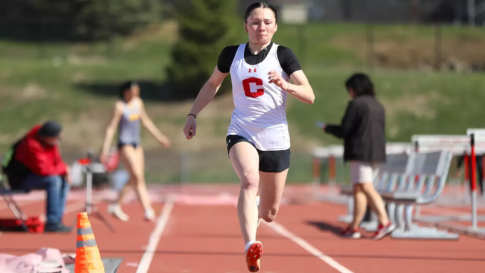 Shayla Greeley running down the long jump track