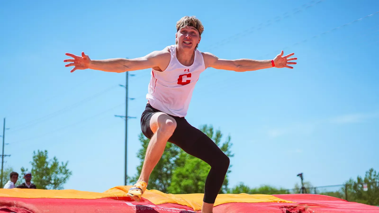 Gage Huyser celebrates after clearing a bar