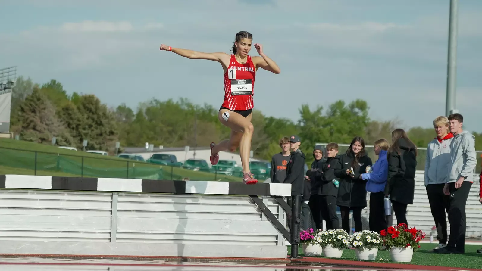 Peyton Steffen jumping over the water hurdle