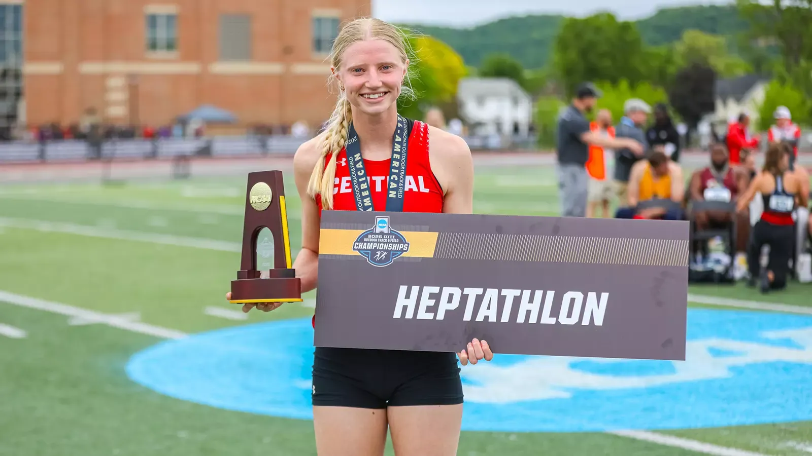 Olivia Bohlen with her National Championship trophy and sign