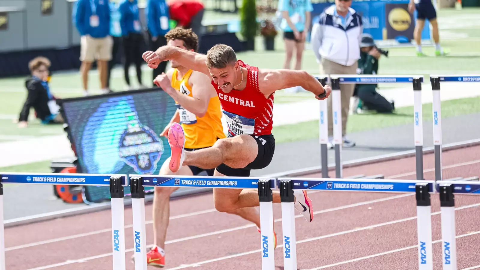 Gavin Smith jumping over a hurdle