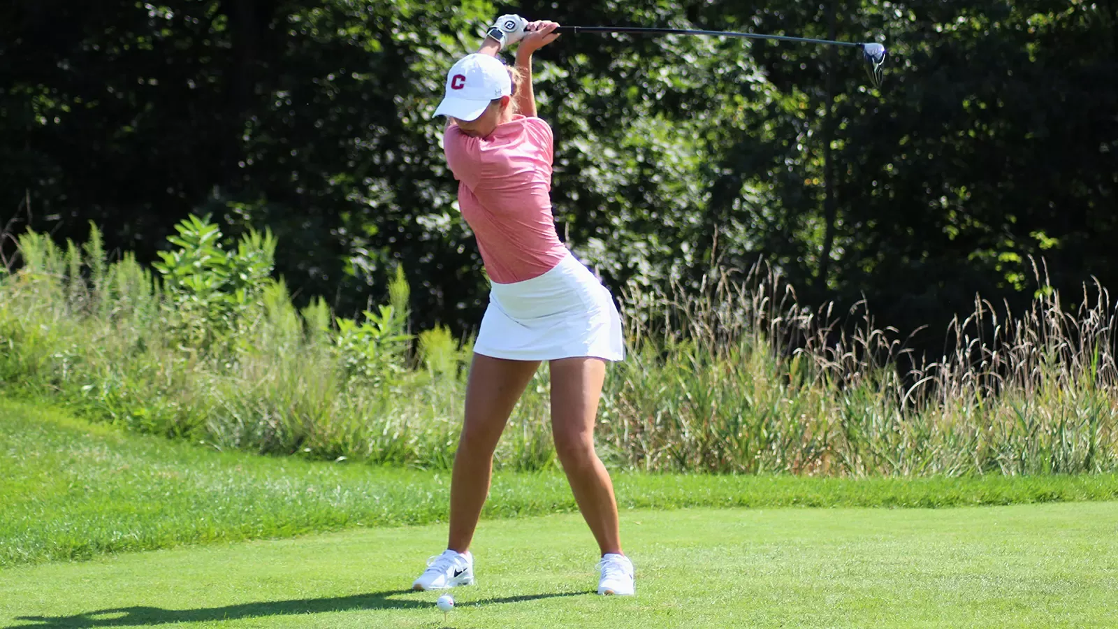Allie Pfantz in her back swing while teeing off