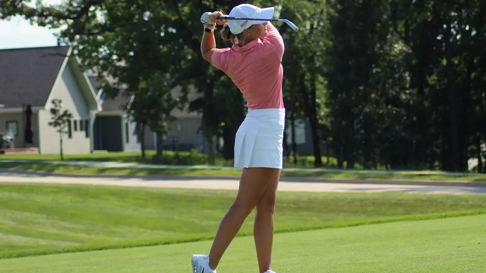 Allie Pfantz in her follow through after an iron shot