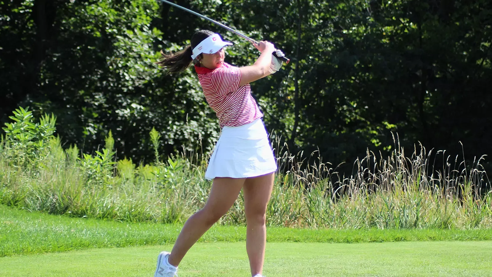Emersyn Schultz in her follow through after teeing off