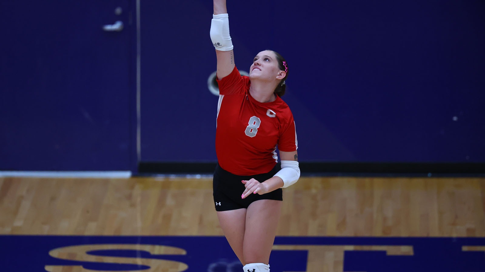 Alex McNab swings during Carleton match