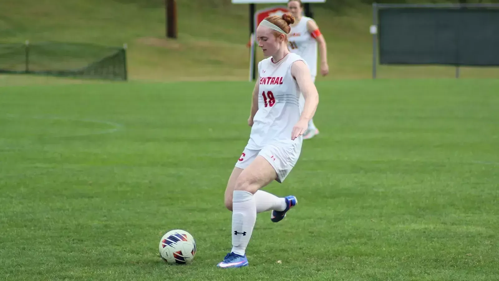 Katy Brown with the ball at her feet looking for a pass