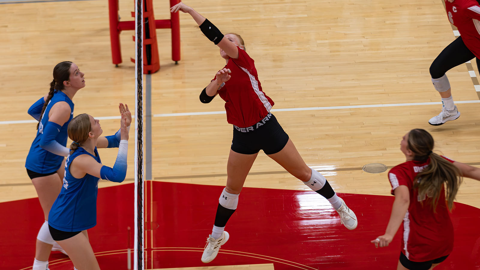 Landry Pacha in volleyball match against Luther