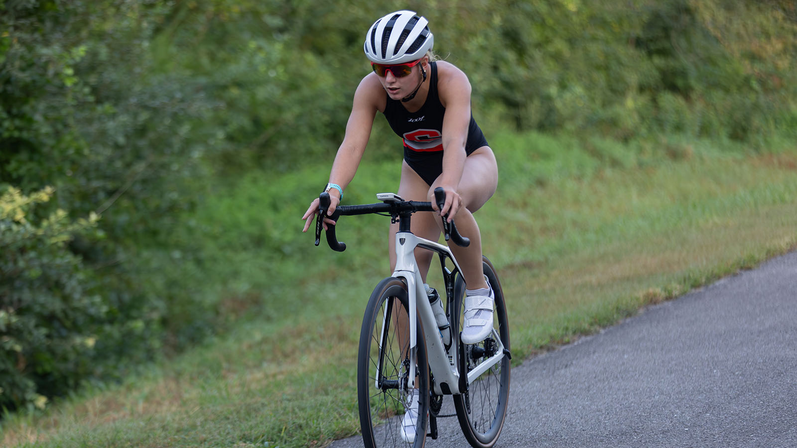 Olivia Ritter competing in a dual triathlon against Coe at Roberts Creek