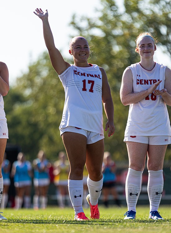 Olivia DeVos waves to the crowd during introductions