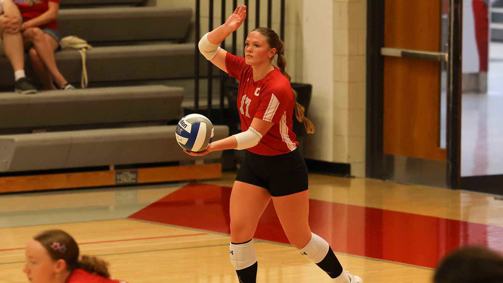 Grace Corey serving against St. Benedict