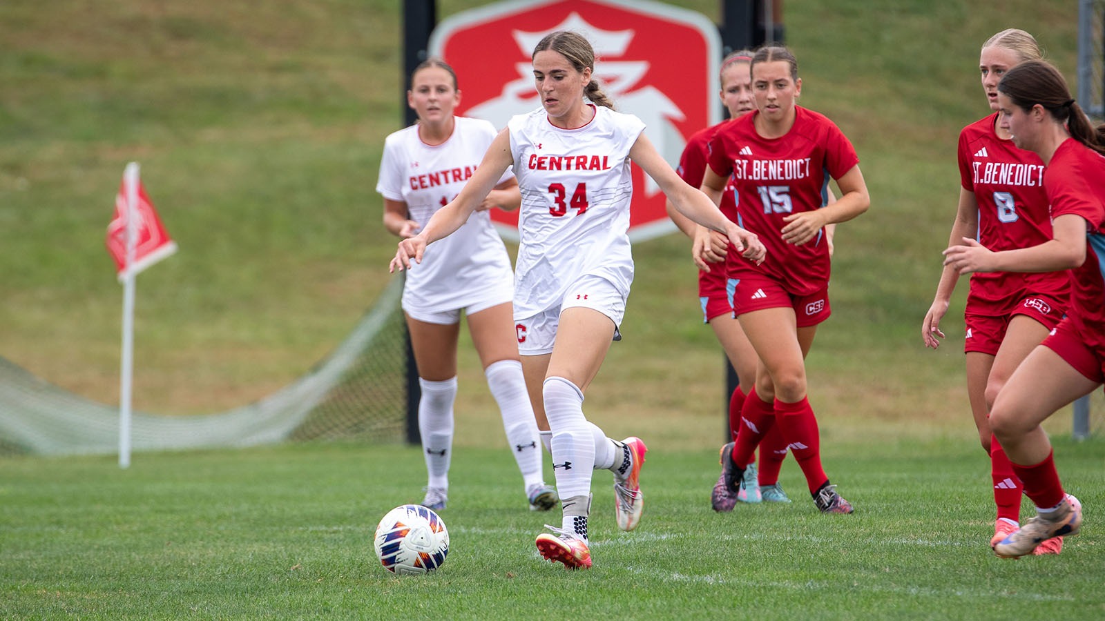 Lila Gwyn dribbles out of a crowd against Saint Benedict