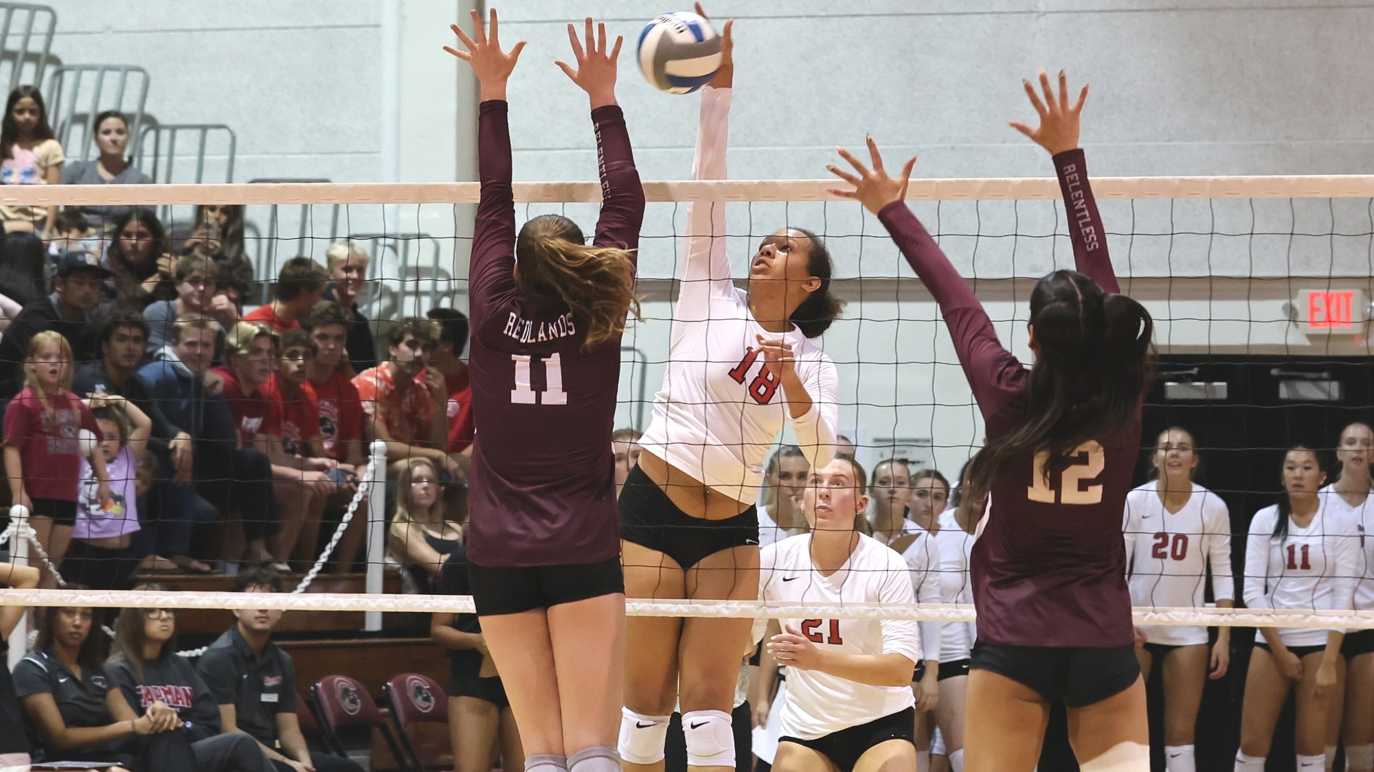 Olivia Harrison hits the volleyball across the net.