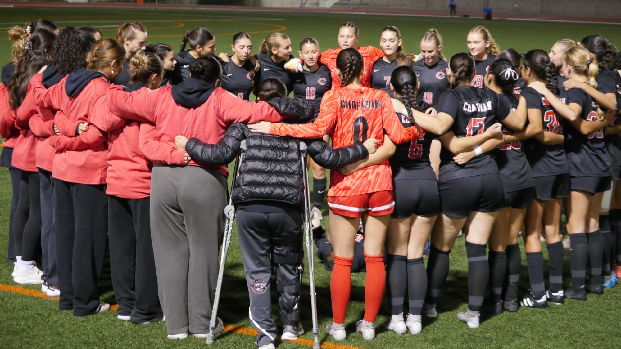 Women's soccer team huddle
