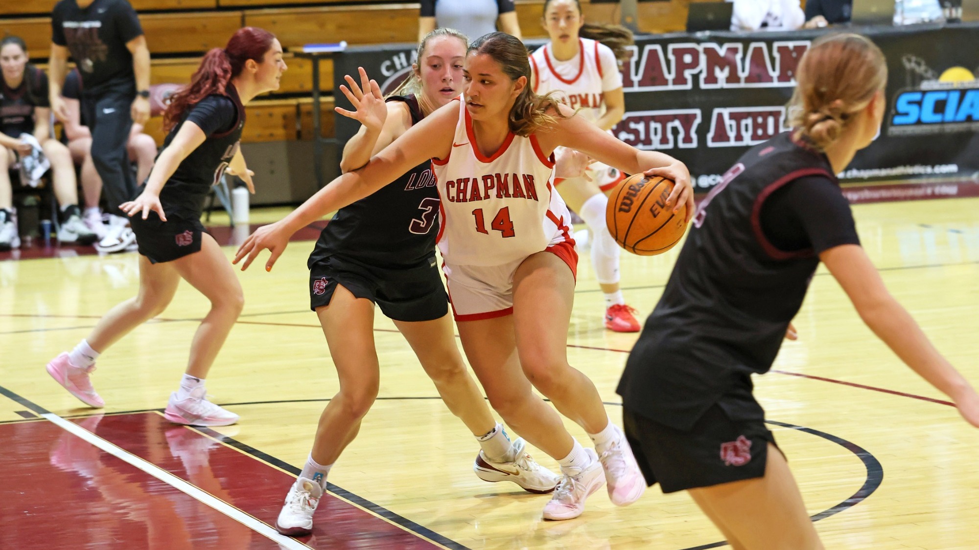 Aidan Sherfey dribble the ball past her opponent.