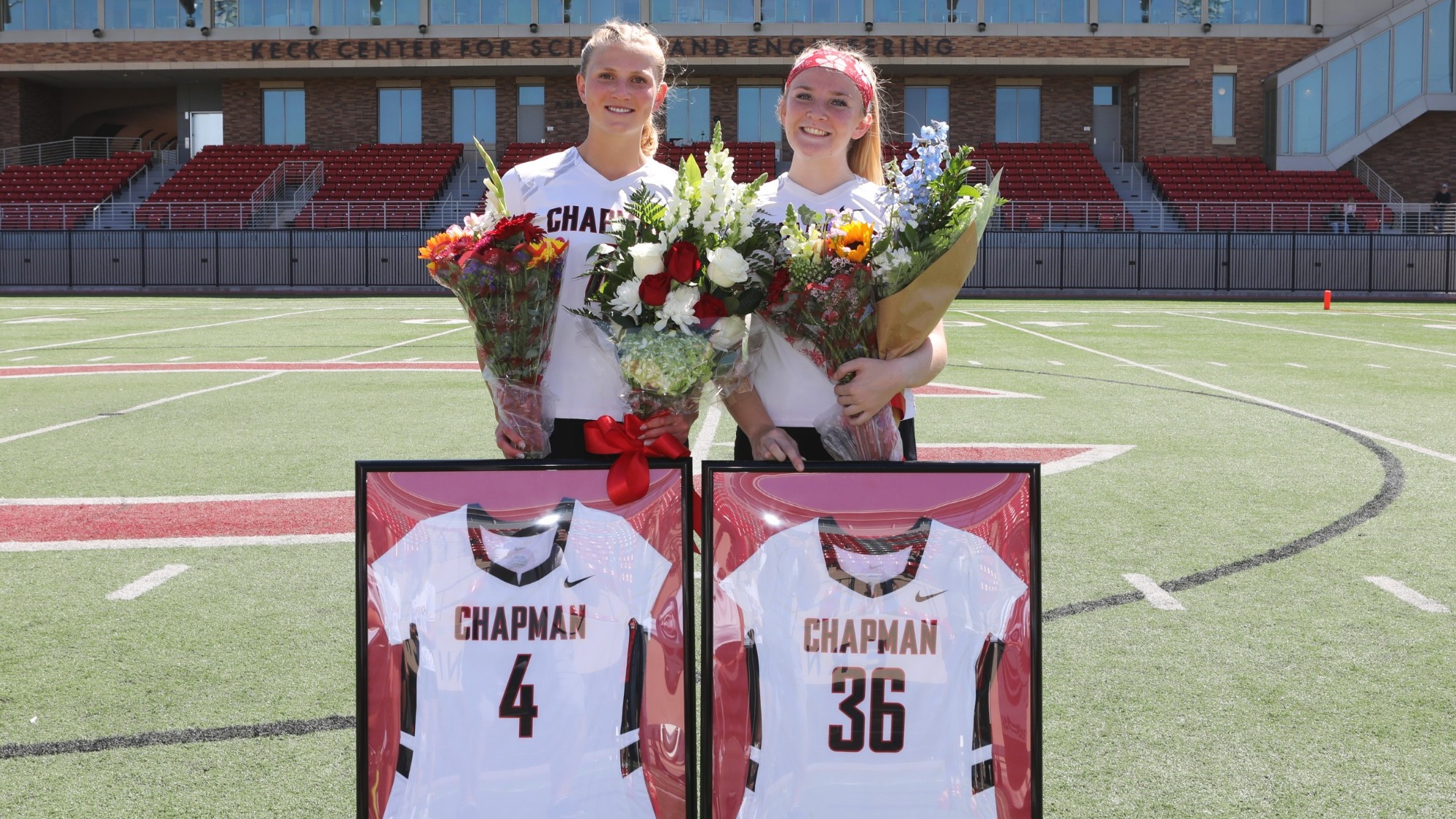 Annika Carlson and Lyndsey Huss holding Senior Day gifts.
