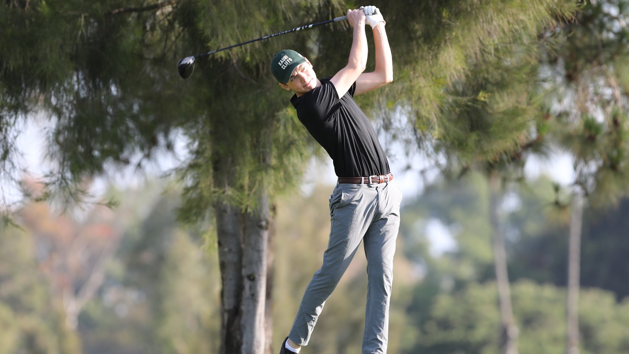 Ben Soicher hits a tee shot on the golf course.