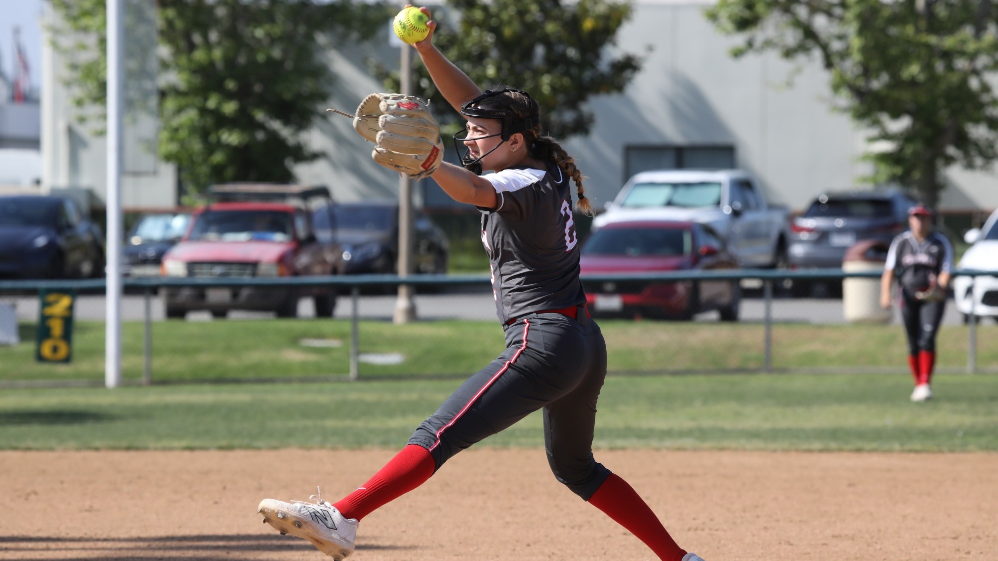 Rose Malen throws a pitch on the softball field.