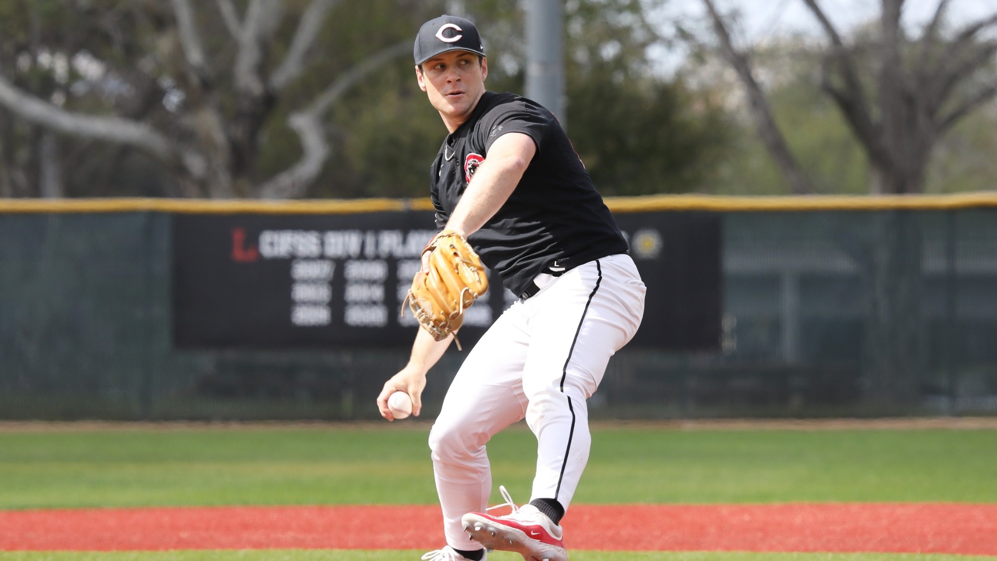 Henry Chabot pitches in a baseball game.