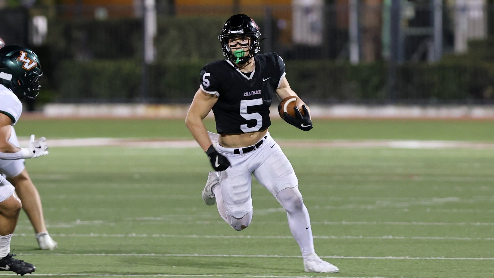 Fischer Huss runs with the football.