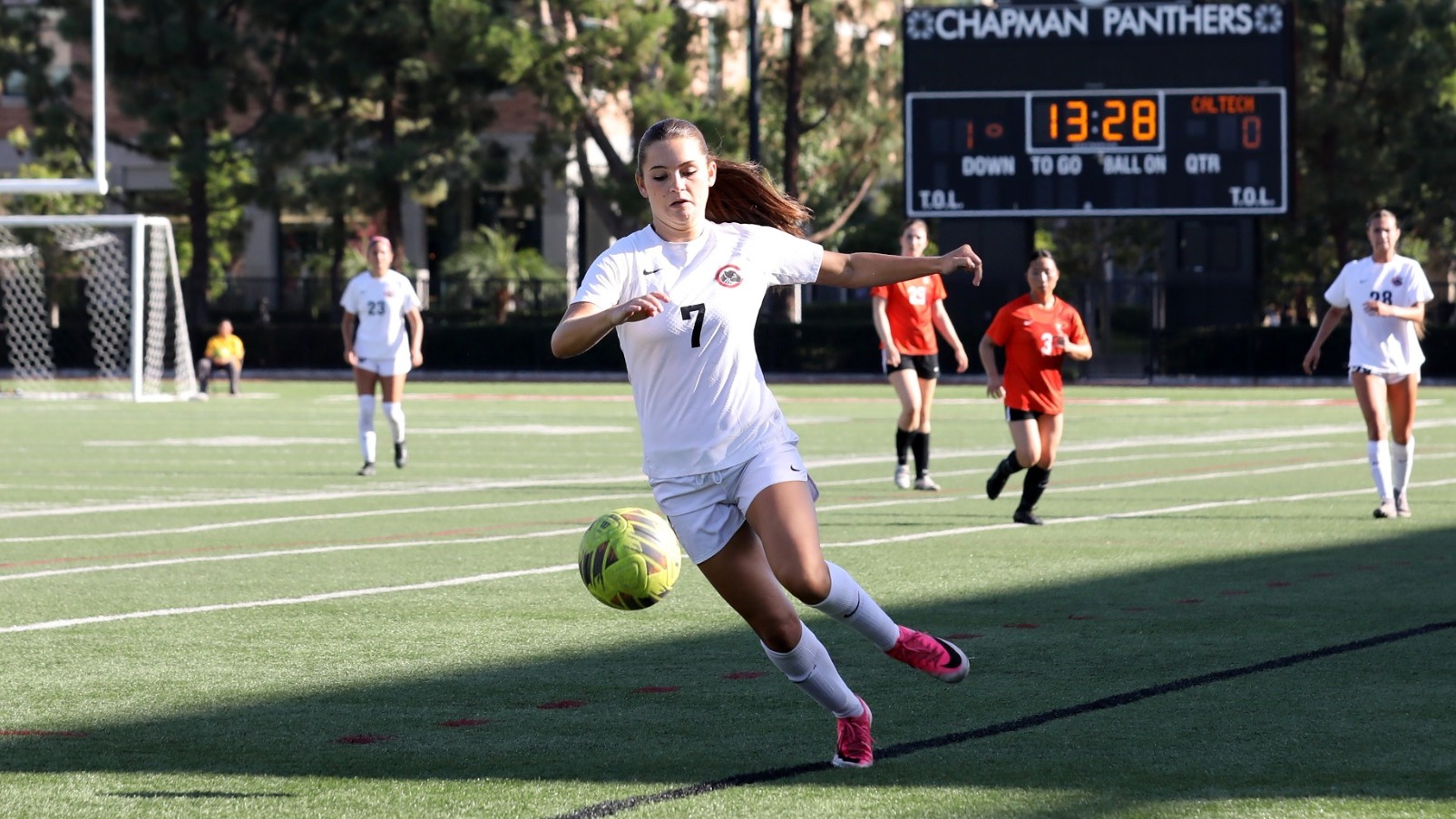 Sidney Karjian on the soccer field and running toward the siccer ball.