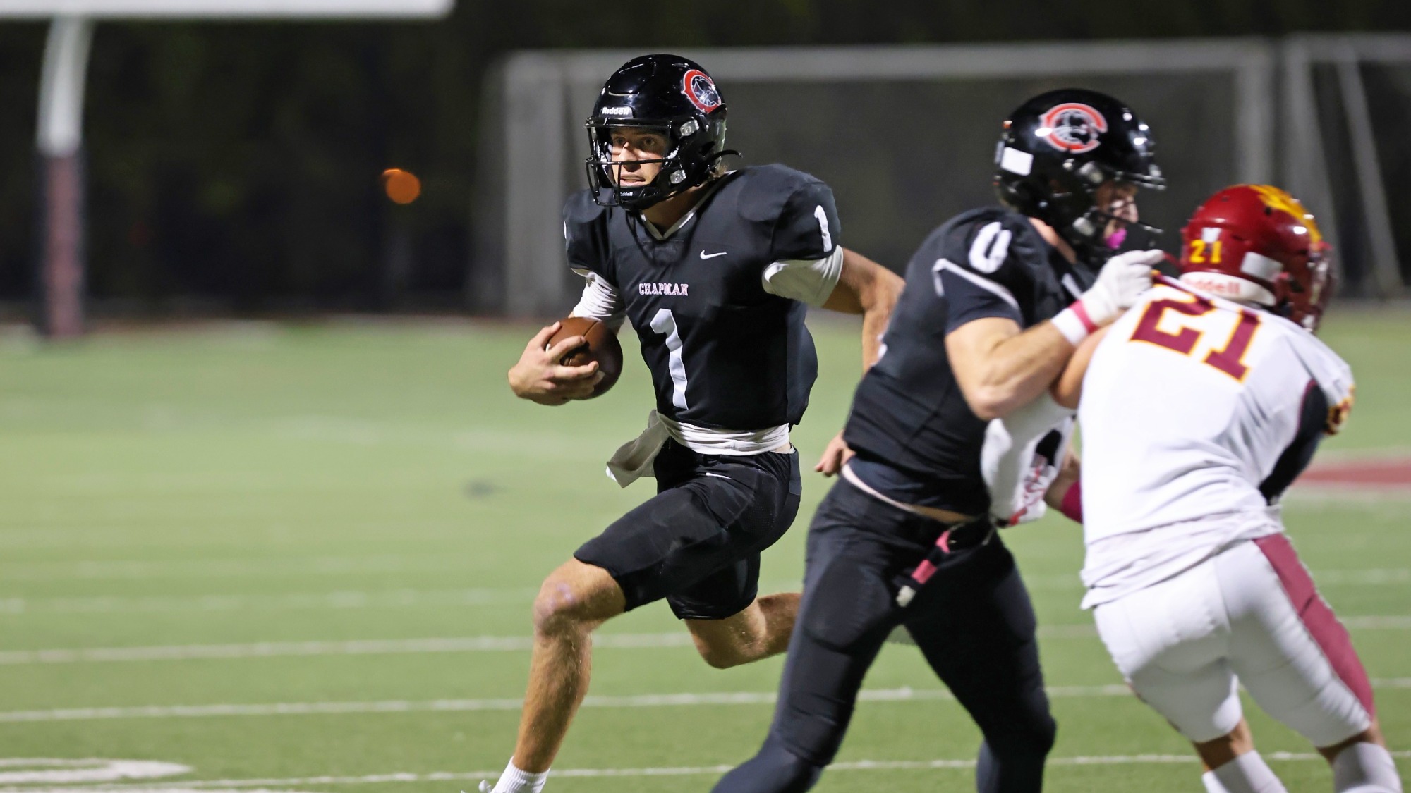 Eli Brandt runs toward the end zone on the football field.