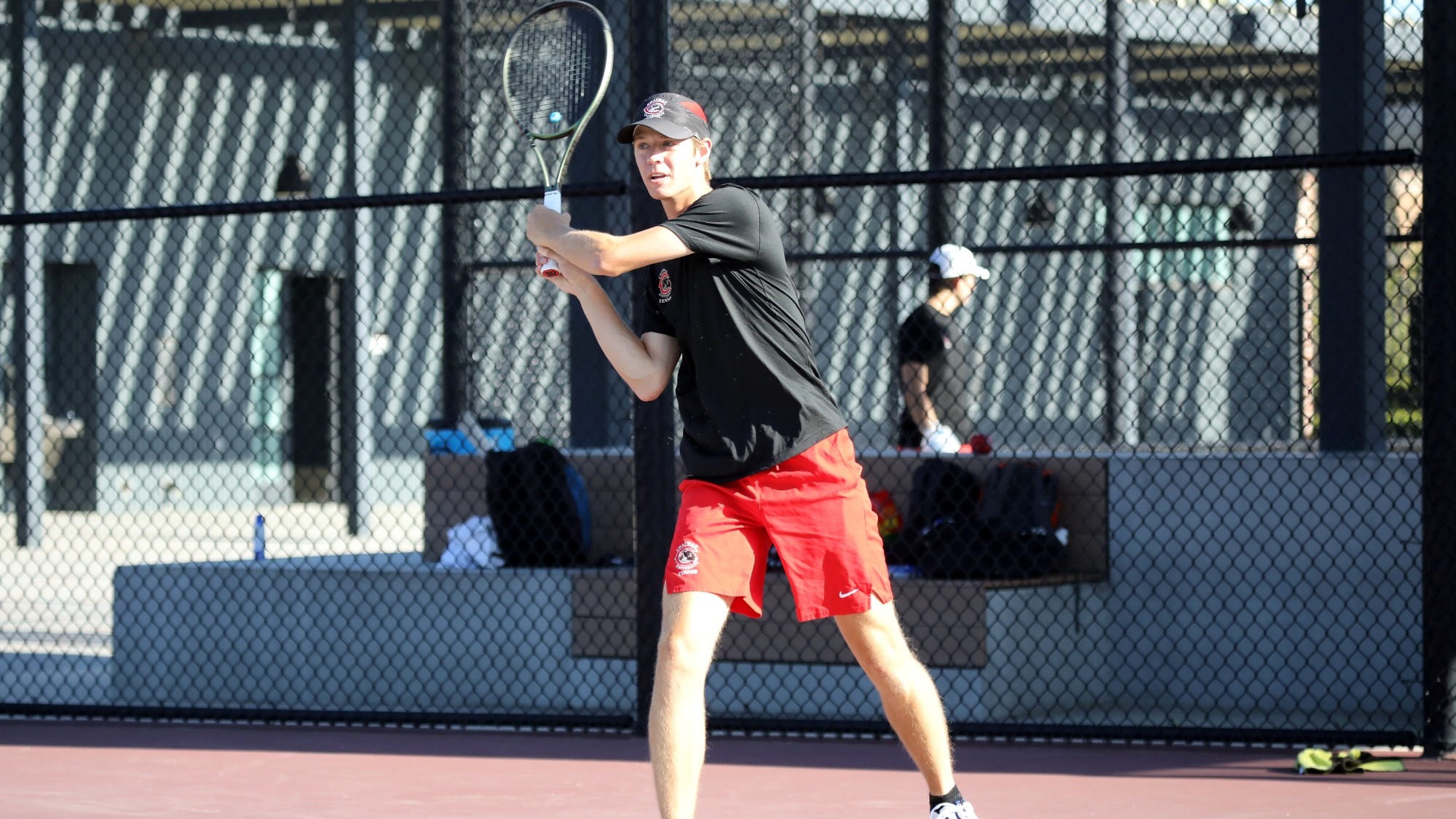 Matthew Dewey on the tennis courts.