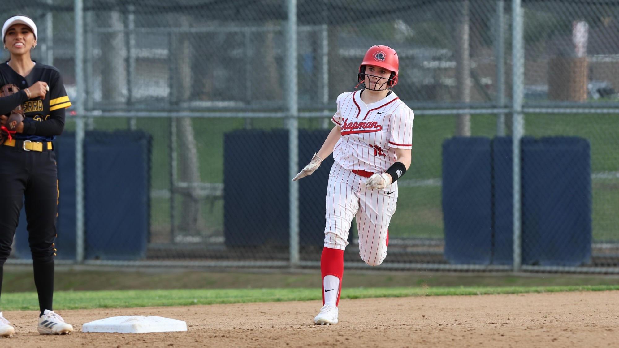 Aleena Helms runs to second base.