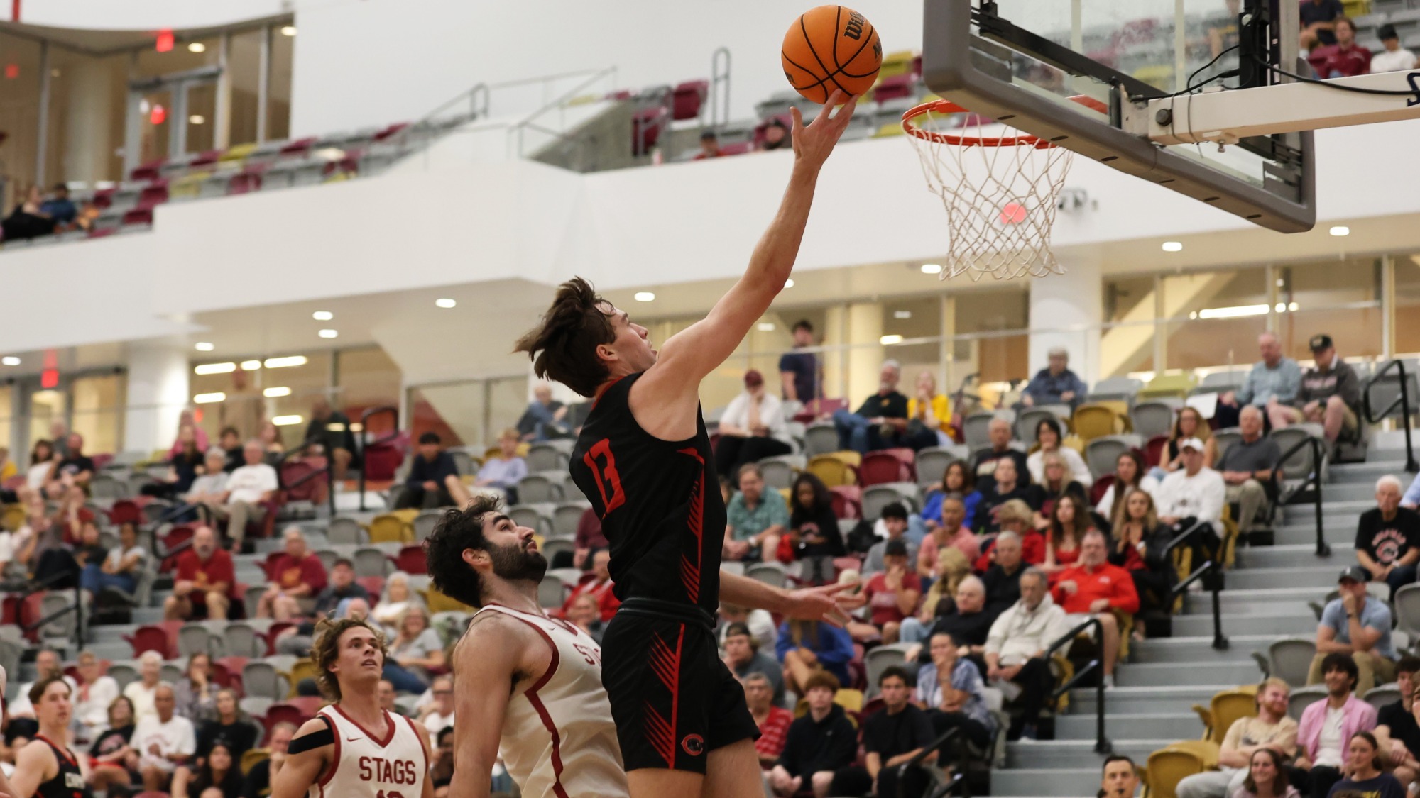 Jake Heberle jumps for a layup over a defender.