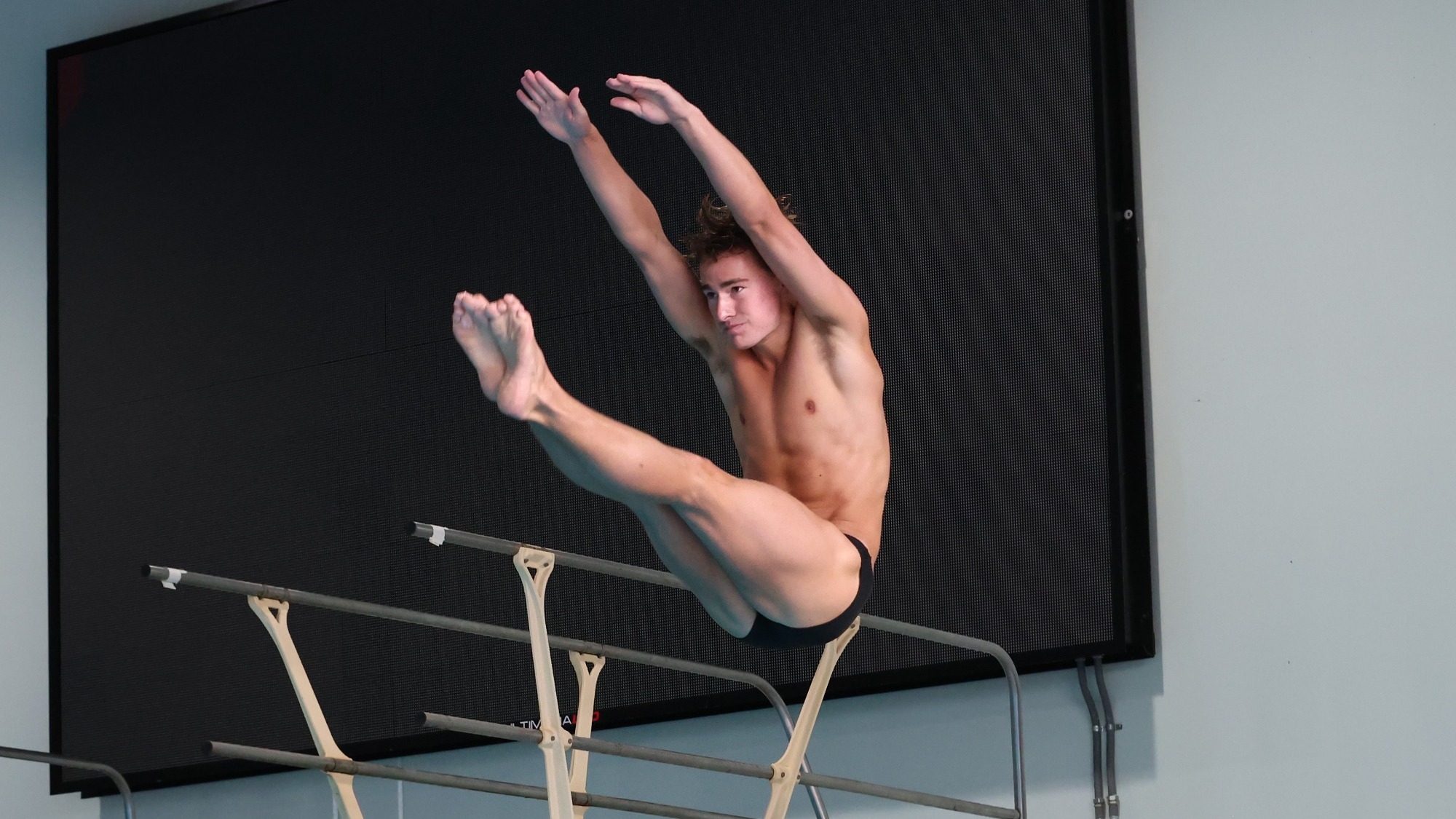 Reid Omilian performs a dive. 