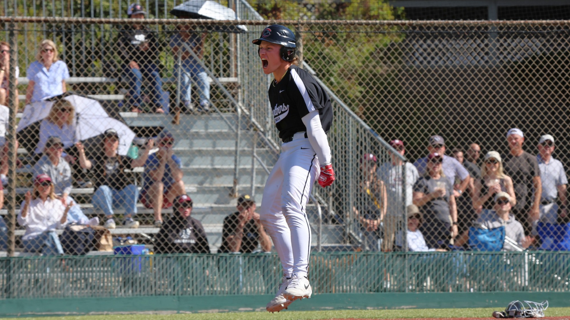 Briggs Ellis celebrates after scoring a run