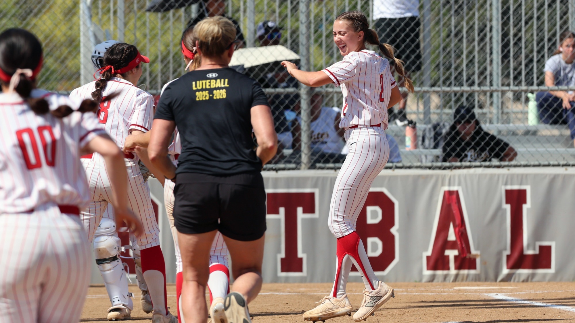 Rose Malen high fives a teammate.