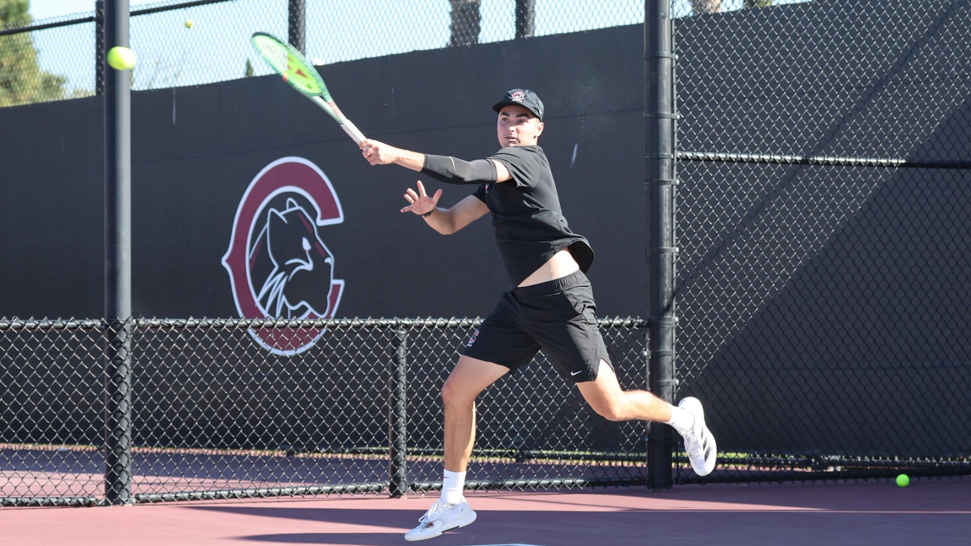 Ian Jordan playing tennis.
