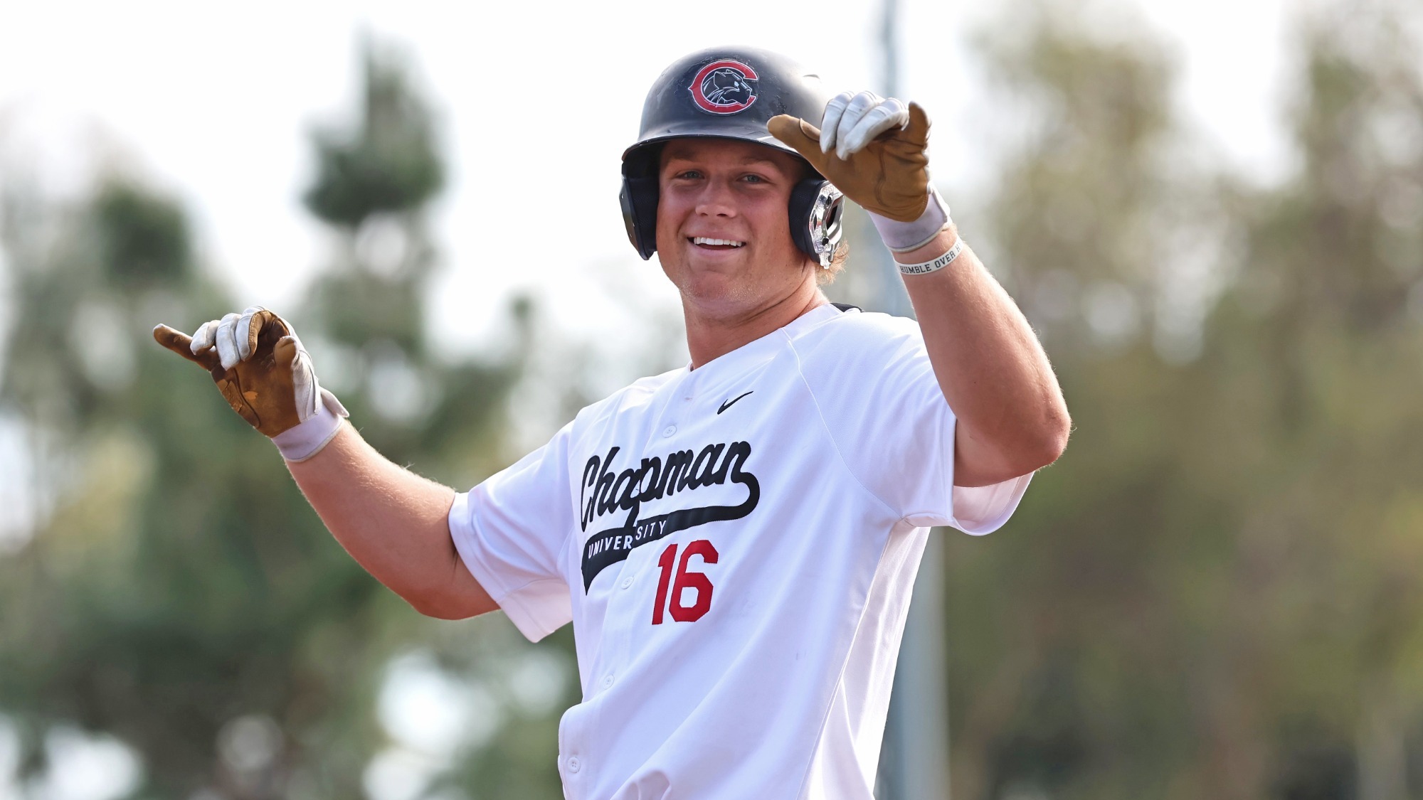 Tate Zimmerman celebrates on base after getting a hit.