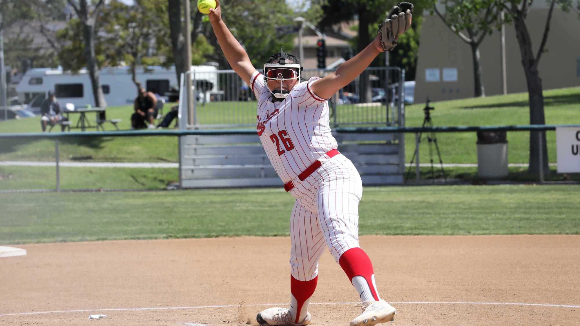 Anabell Hinojosa pitching on the softball field.