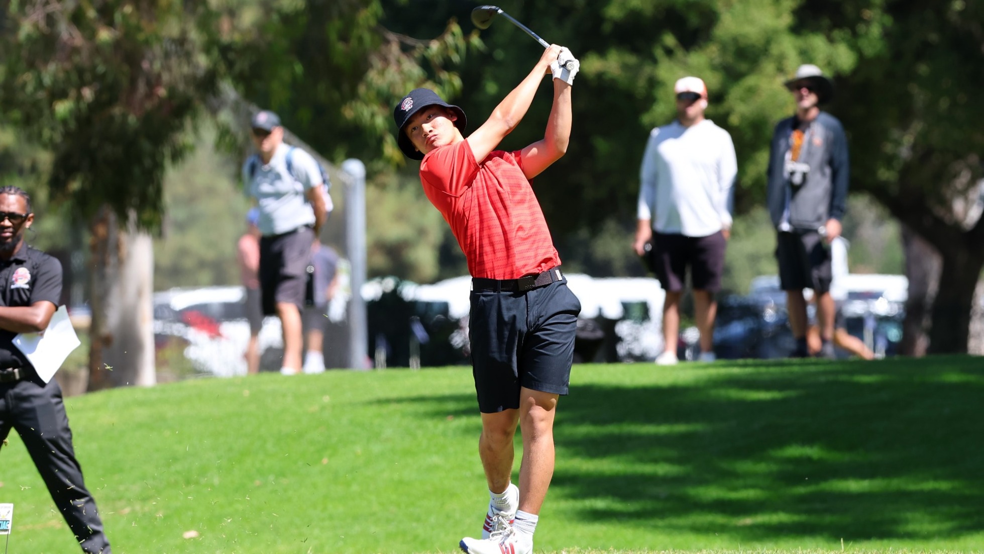 Kendrick Tan on the golf course after hitting his tee shot.