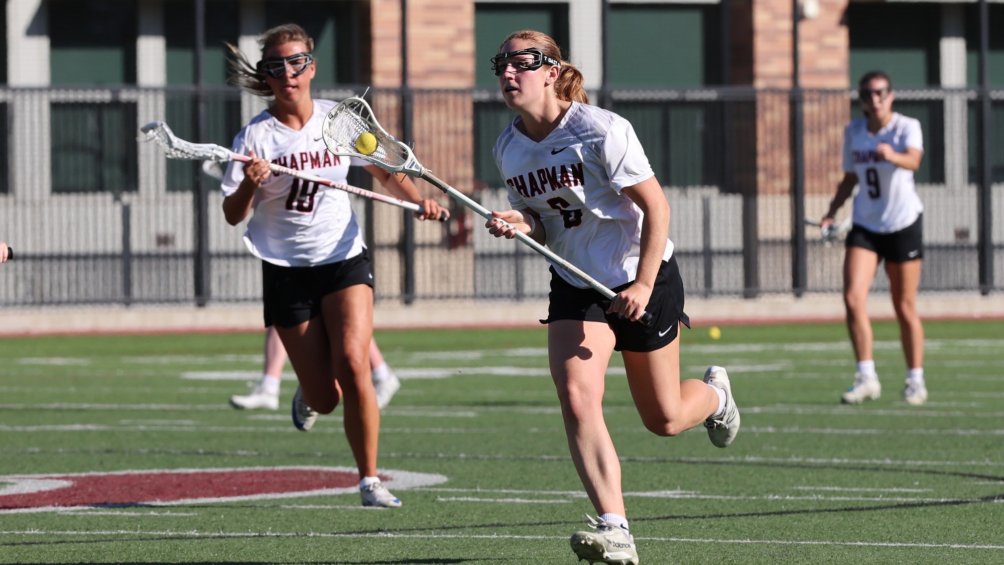 Tade Scheid runs down the lacrosse field.