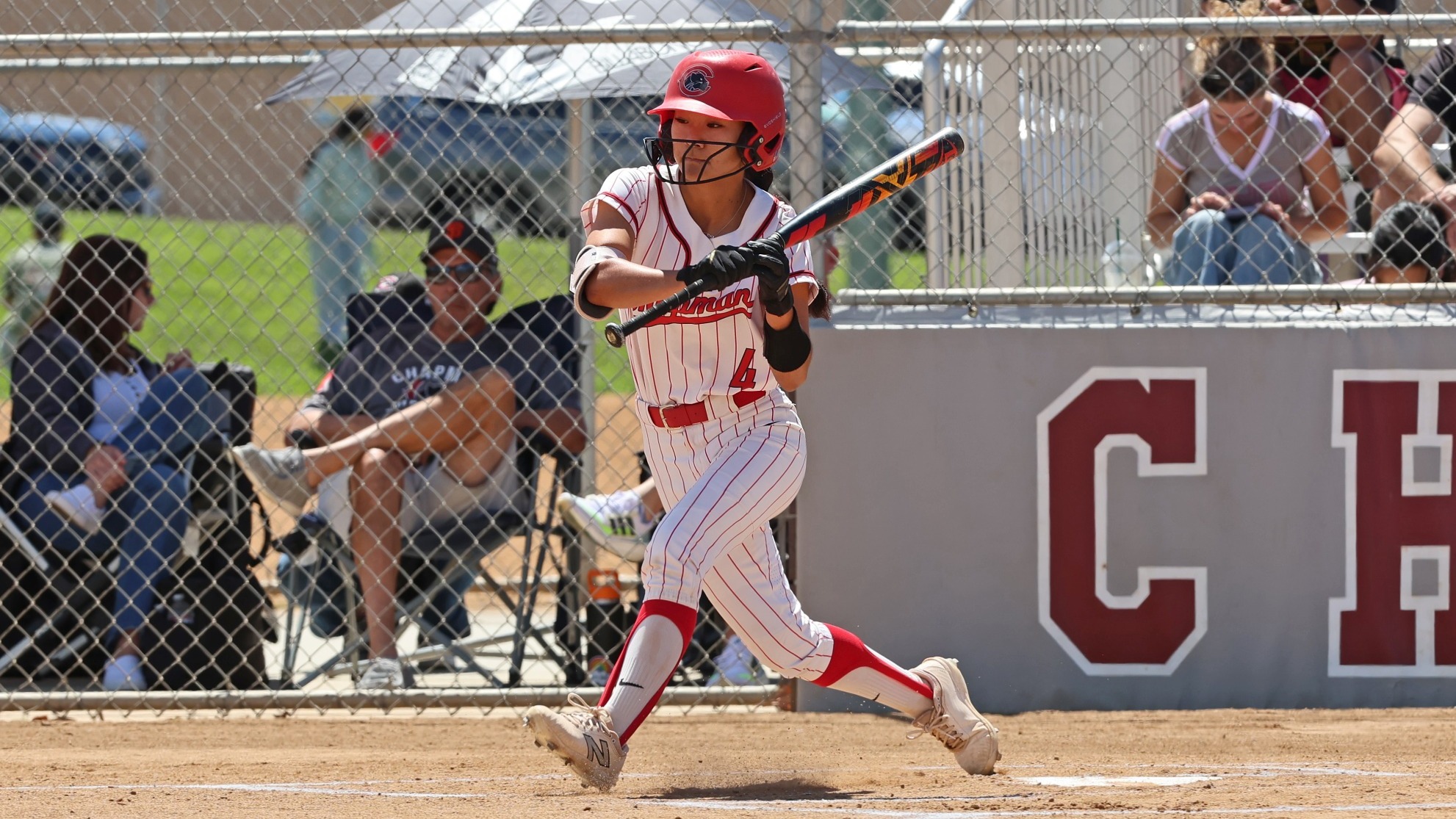 Shea Higa attempts to bunt a pitch