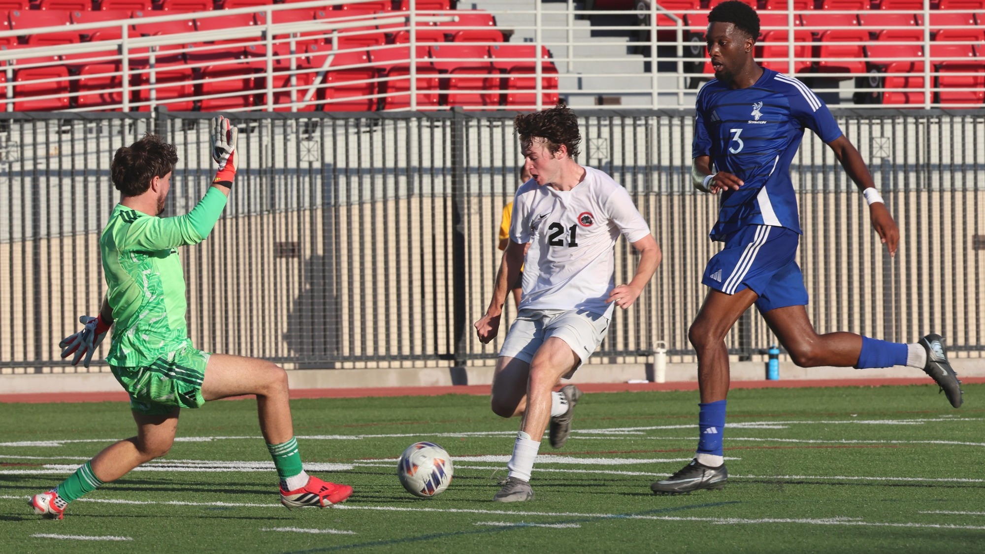 Hudson Weinberger dribbles around a soccer defender.