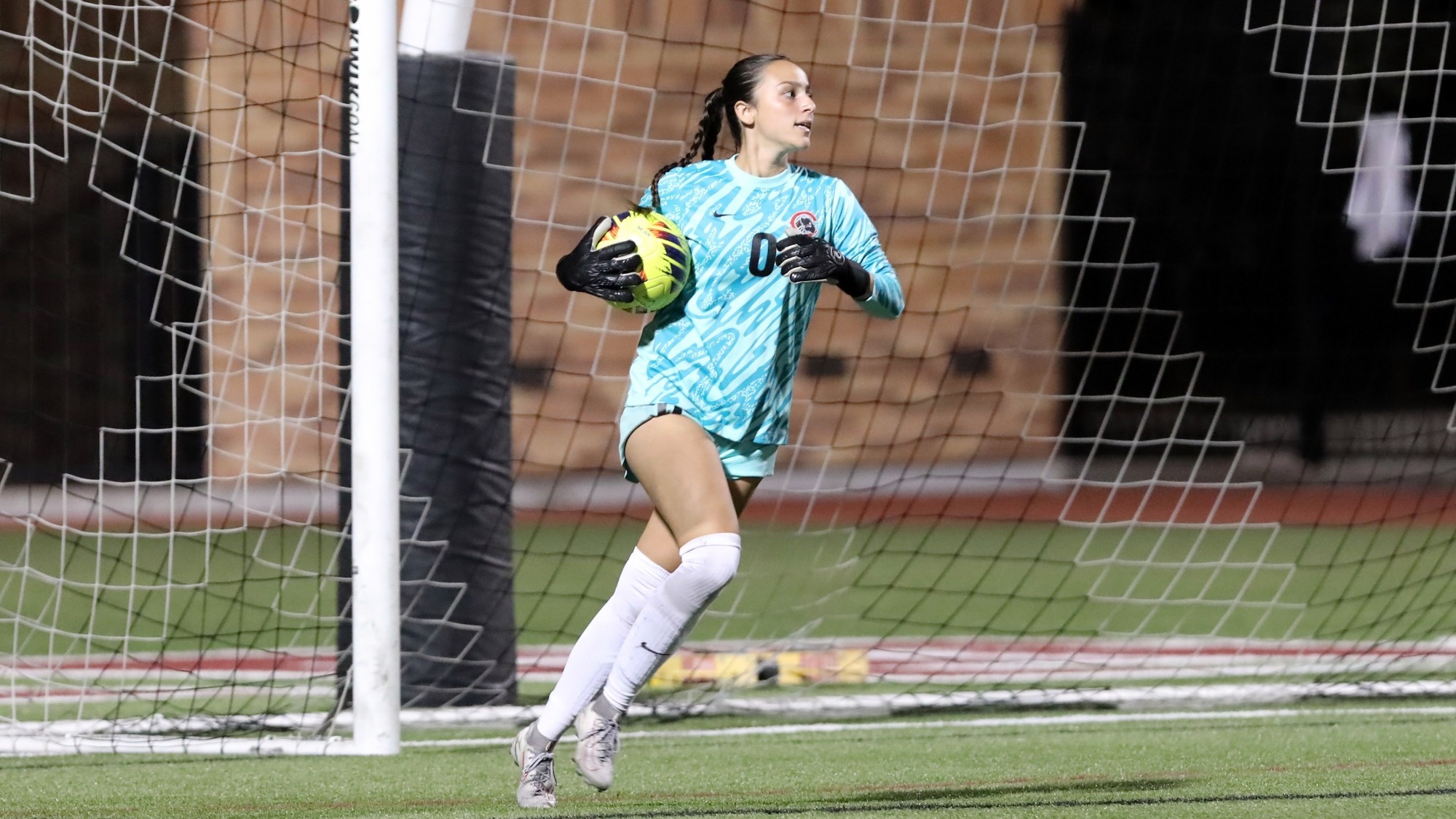 Sienna Gomez holds the ball after making a save.