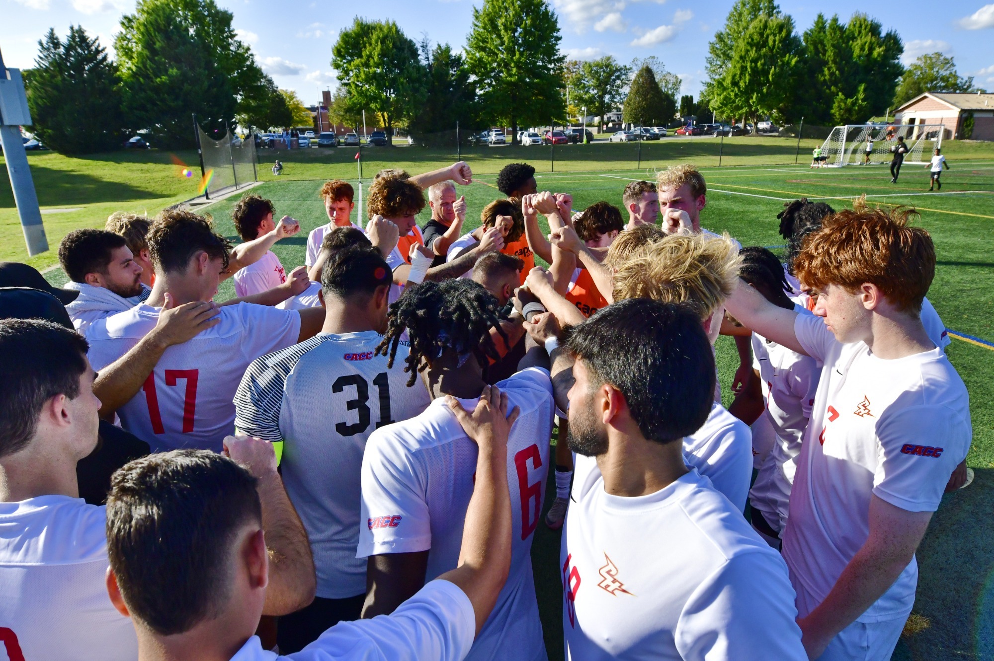 Men's soccer huddle 2025