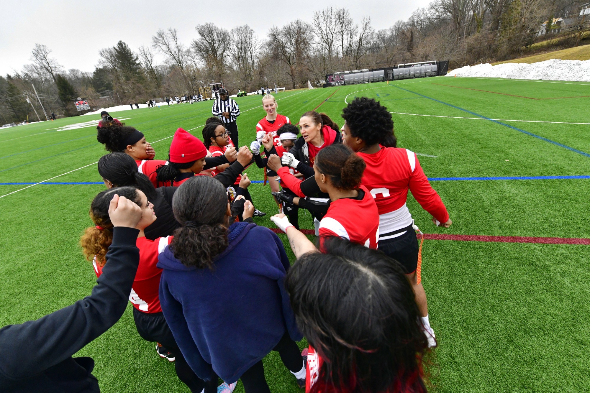 Flag football huddle