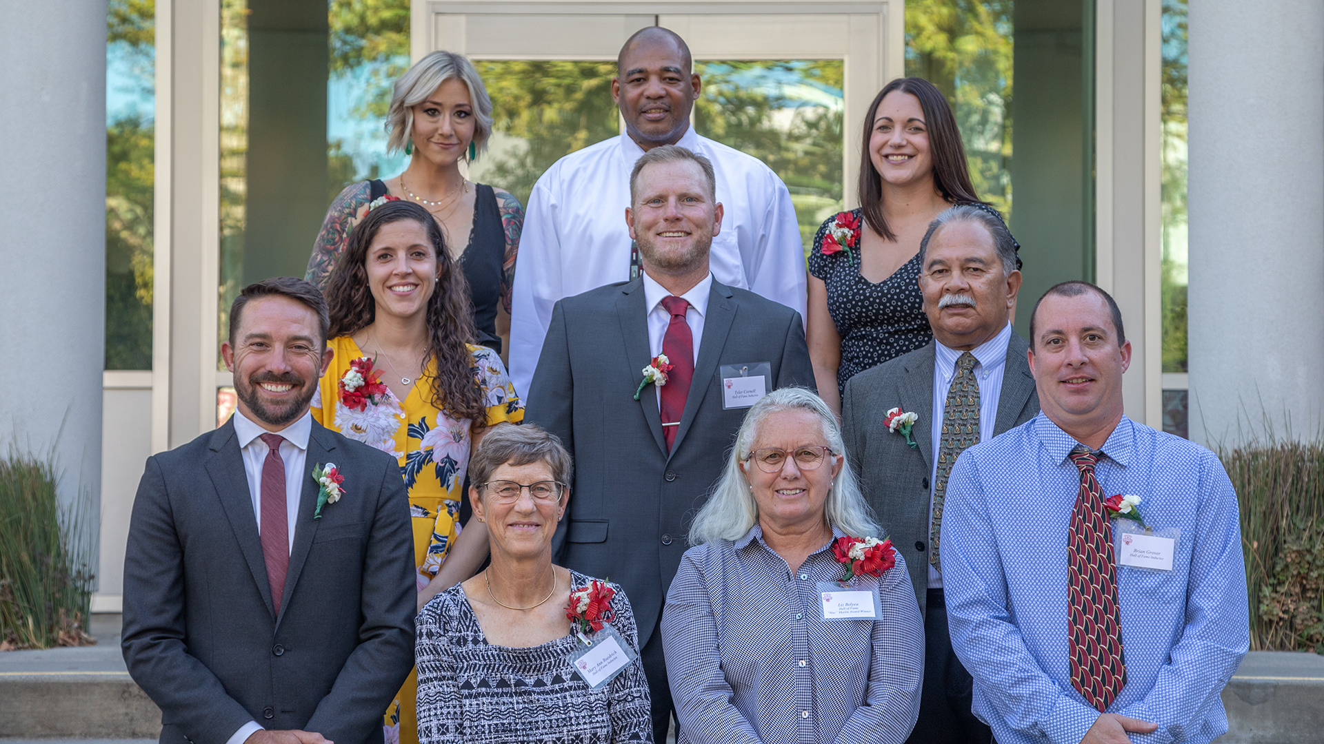 The 2019 Chico State Athletic Hall of Fame Class of 2019 honorees: (top row left to right) Chelsea Lundberg, David Fluker, and Lauren Himmelspach; (middle row left to right) Jen (James) Serna, Tyler Cornell, and Rocky Raquel; (bottom row left to right) Tyler Graff, Mary Anne Ruedrich, Liz Belyea, and Brian Grover, are pictured on the steps in front of the Bell Memorial Union.