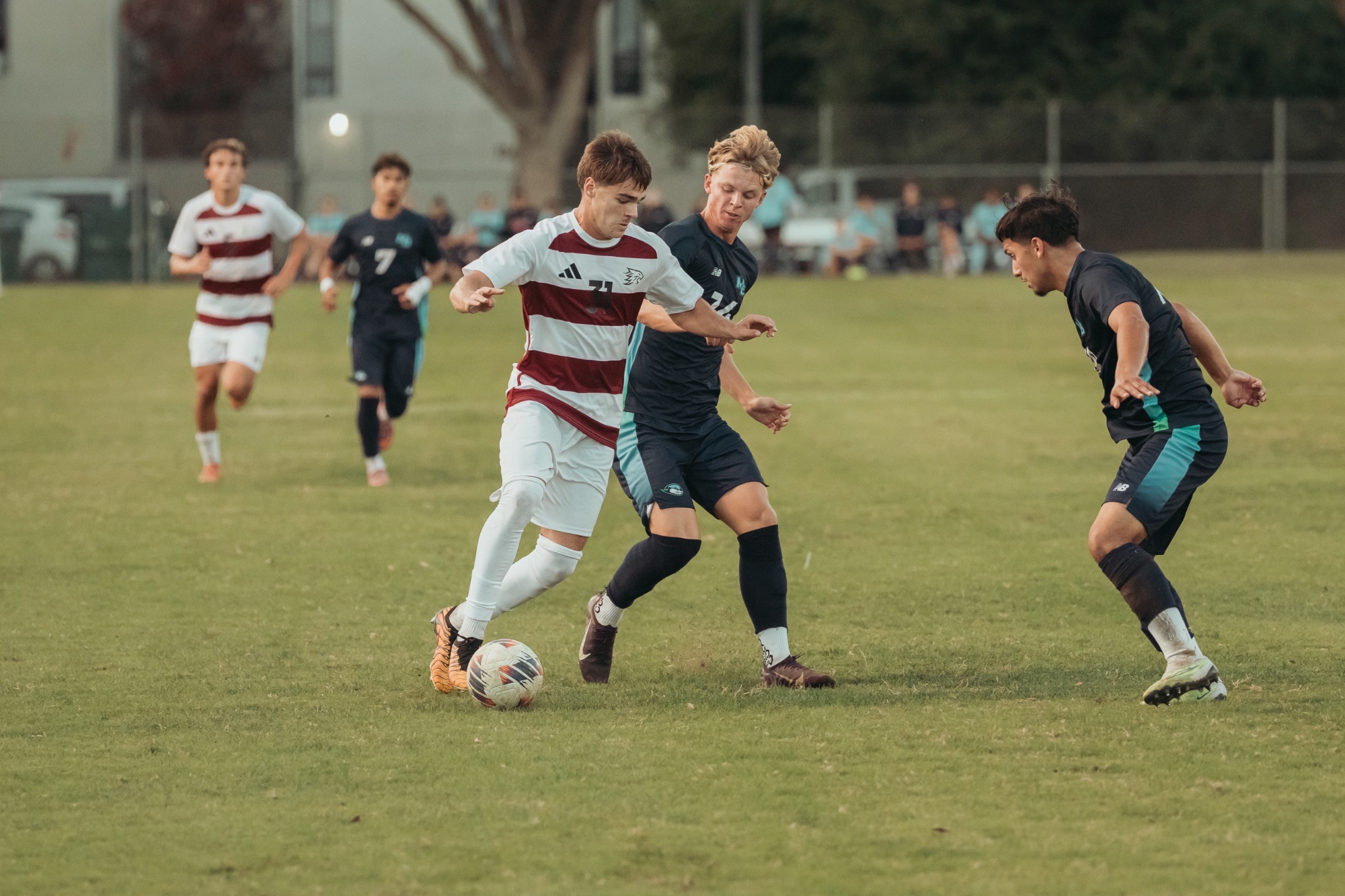 Carter Haynes Dribbling the ball against the Otters of CSUMB