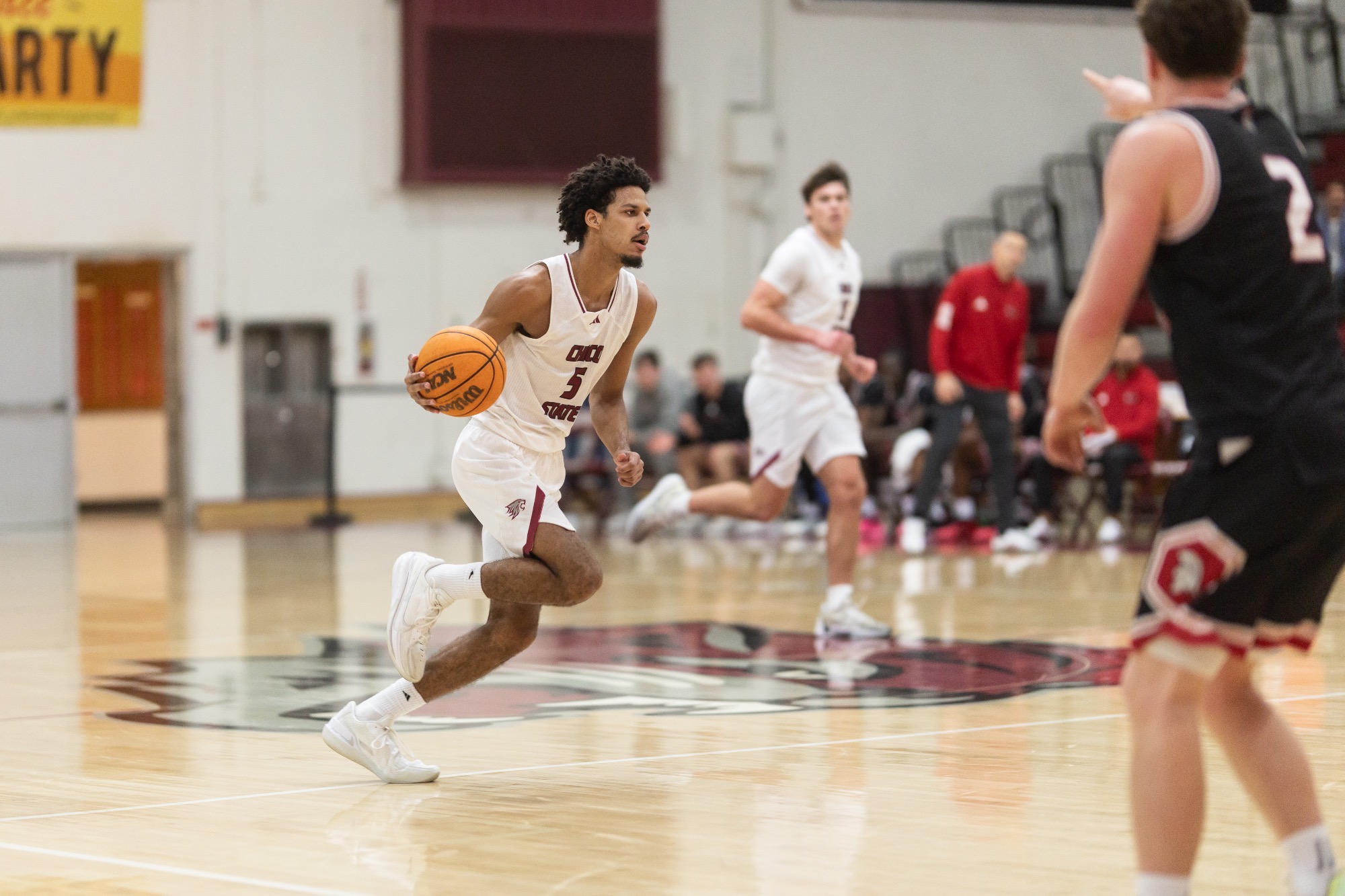 Dargan dribbling the ball at the Saint's basket