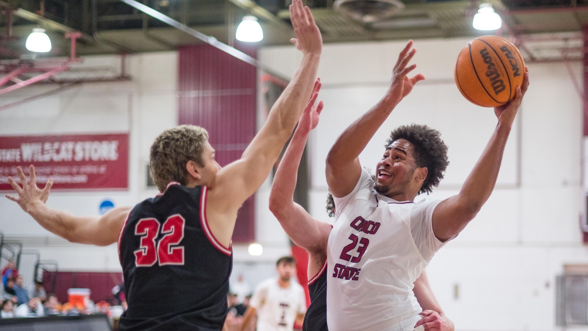 Chico State Wildcats #23 Cortevious Taylor (right) takes a shot against Simpson University Red Hawks in the first half of their Men's Basketball (MBB) game on Wednesday, November 26, 2025 in Chico, Calif.(Jason Halley/University Photographer/Chico State)